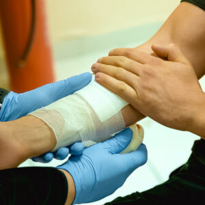 Applying a bandage during first aid training in HLTAID011 - Provide First Aid course.