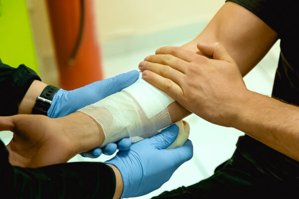 Applying a bandage during first aid training in HLTAID011 - Provide First Aid course.